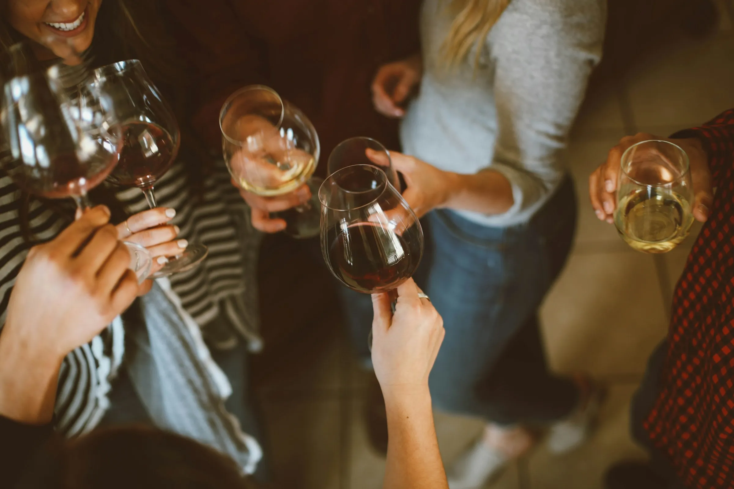A couple raising glasses in a toast